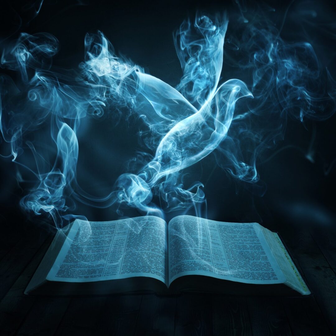 A dove flies out of the smoke from a Bible